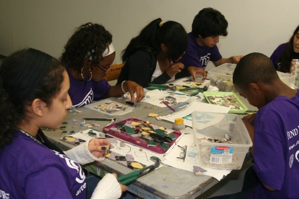 After School Matters teens work on the 57th street mosaic mural.